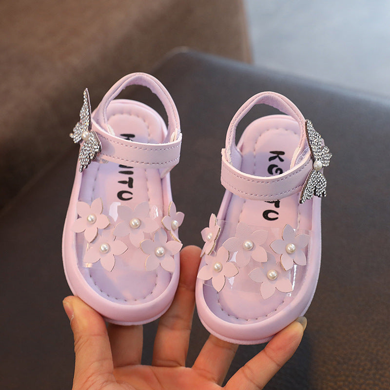 Pastel pink toddler sandals with floral appliques and pearl details, FashionRay style