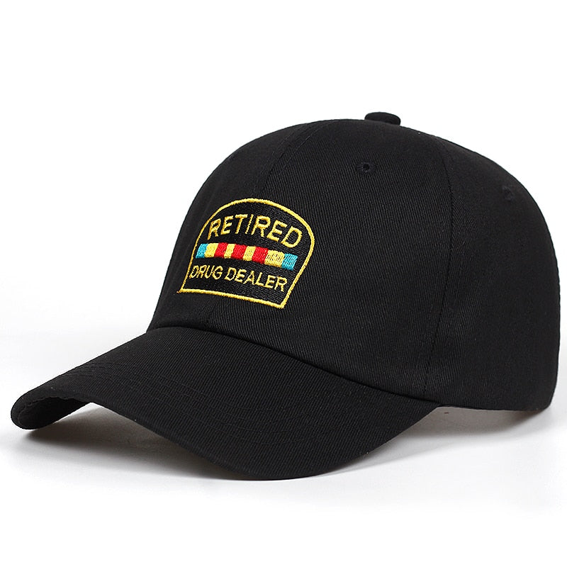 Black baseball cap with humorous 'Retired' embroidered patch, bold streetwear from FashionRay.