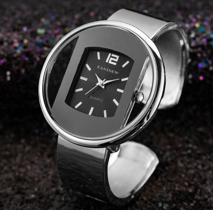 FashionRay silver bangle wristwatch with black dial and quartz movement on dark background
