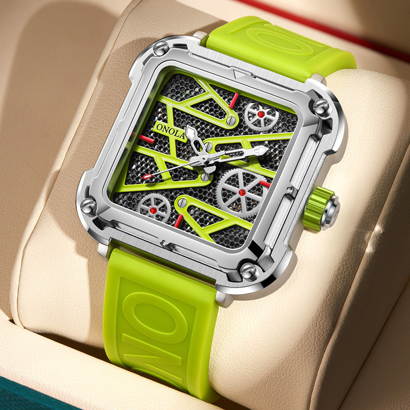 Trendy square face watch with a neon green strap, exposed gears, and metallic details, FashionRay