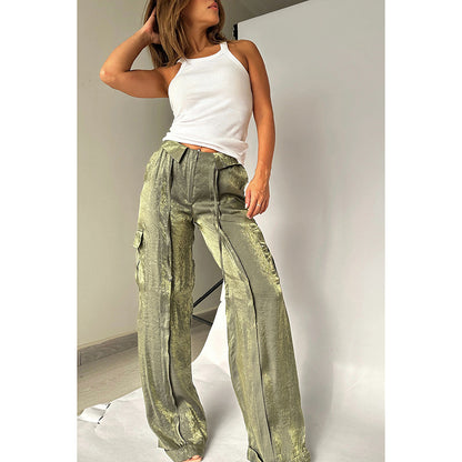 Woman modeling metallic green cargo pants and white tank top, FashionRay trendy style