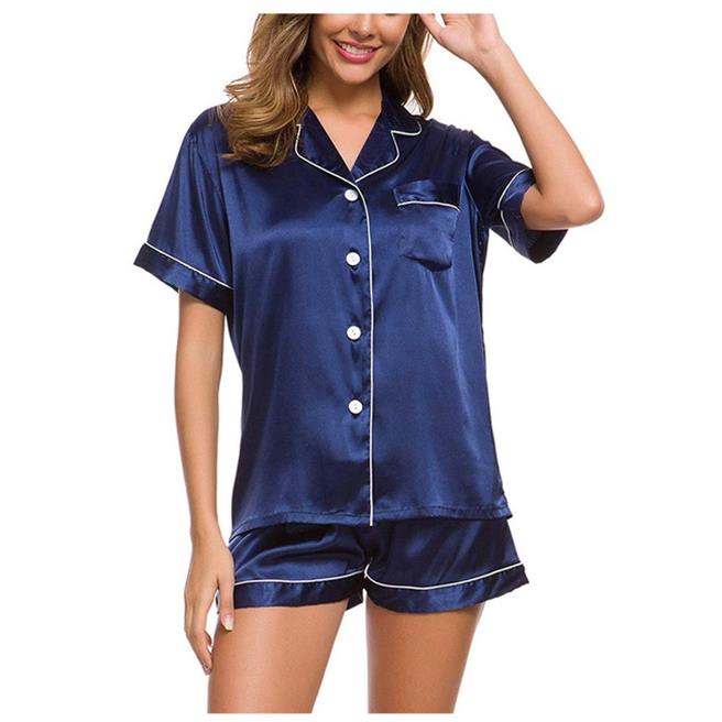 Woman wearing navy satin short sleeve pajama set with white trim, FashionRay loungewear