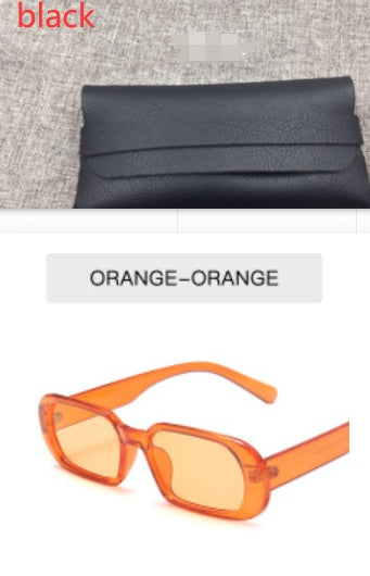 Black clutch bag and orange sunglasses on FashionRay for trendy accessories.