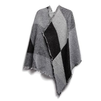 Gray and black checkered poncho with fringe edges, trendy outerwear from FashionRay