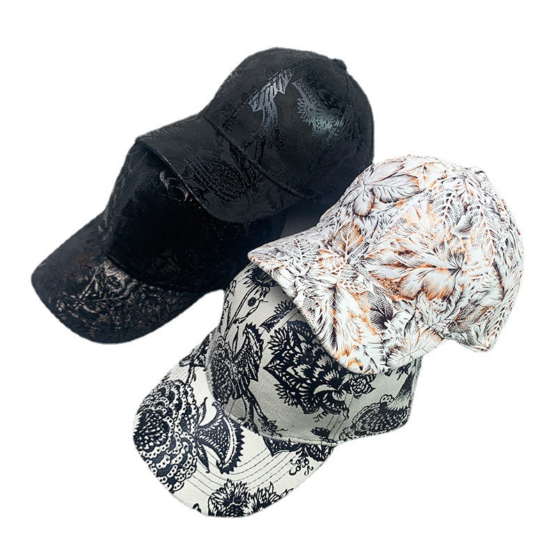 Trendy patterned baseball caps in black, white, and floral designs from FashionRay