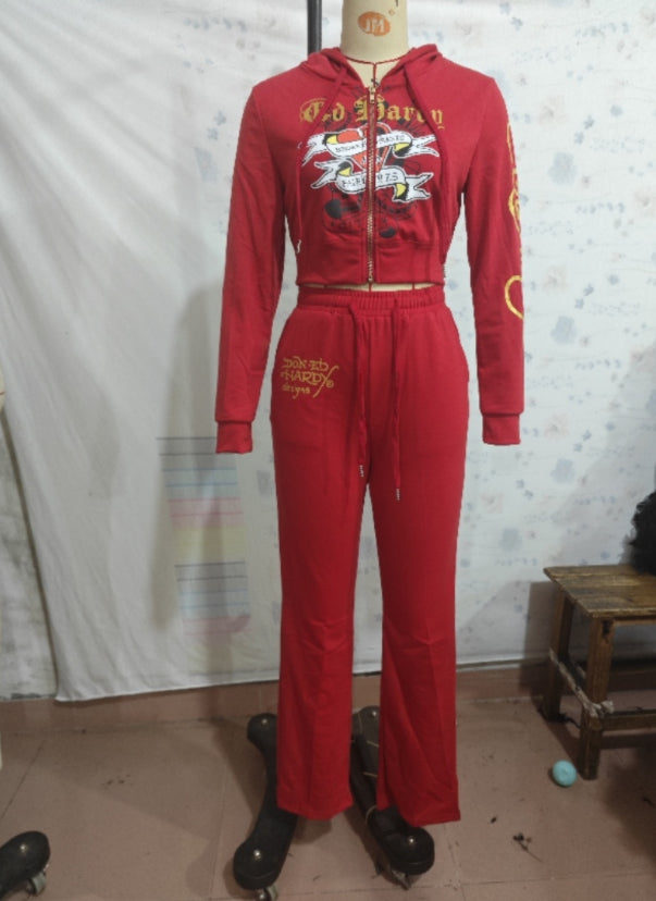 Red Ed Hardy tracksuit with graphic print on mannequin, trendy fashion at FashionRay