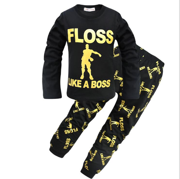 Black kids pajama set with yellow 'FLOSS LIKE A BOSS' print and dance graphic, FashionRay style