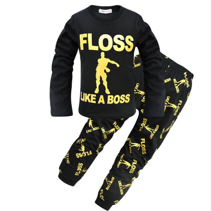 Black kids pajama set with yellow 'FLOSS LIKE A BOSS' print and dance graphic, FashionRay style