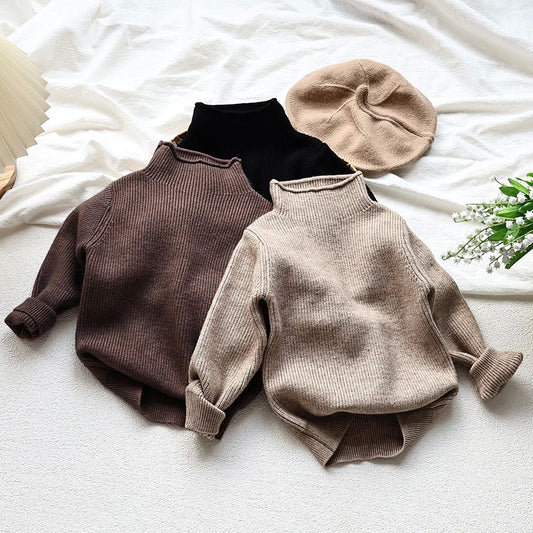 Cozy knit turtleneck sweaters and a beige beret on a white blanket, FashionRay trendy comfort style