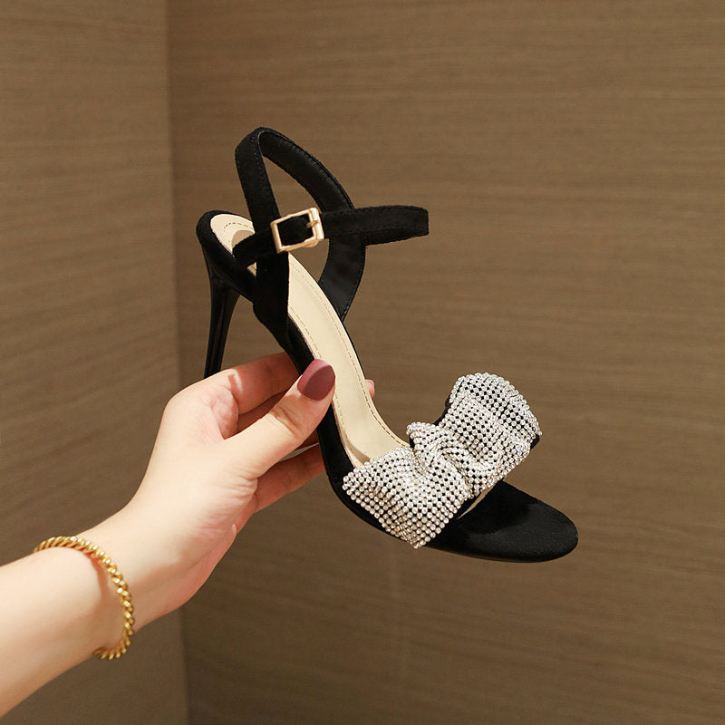FashionRay black high heel sandal with rhinestone bow detail, trendy women's footwear