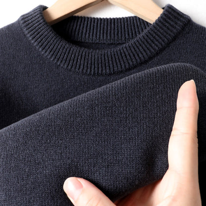 Close-up of a soft navy knit sweater on hanger, FashionRay comfy affordable fashion