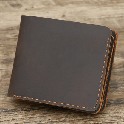 Brown leather wallet with visible stitching on rustic wooden surface, FashionRay accessories