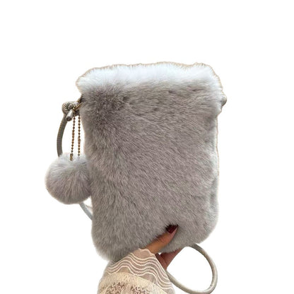FashionRay soft gray faux fur crossbody bag with pompom and gold chain detail, trendy accessory