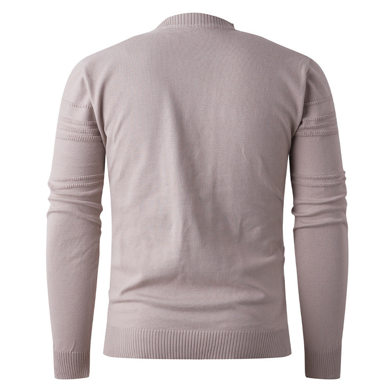 Back view of a light beige knit sweater with ribbed cuffs from FashionRay
