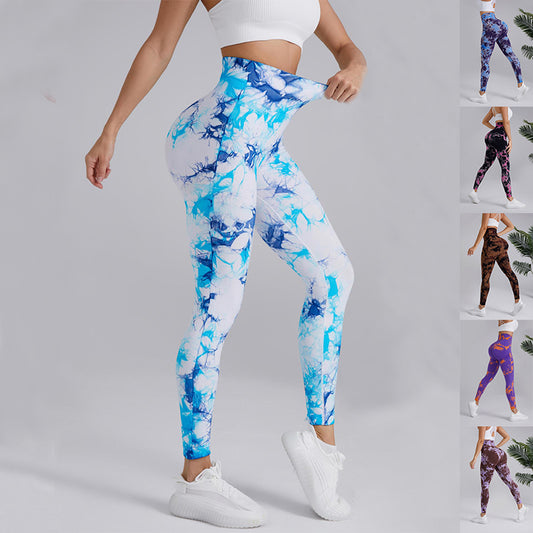 Woman wearing blue tie-dye high-waisted leggings and white sports bra, FashionRay activewear