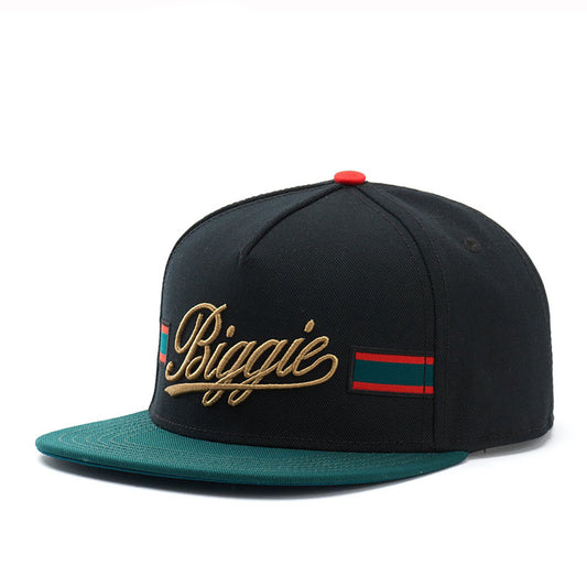 Black snapback cap with gold 'Biggie' embroidery, green brim, red and green striped accents