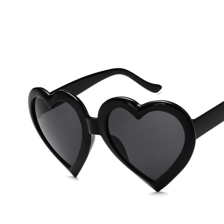Trendy black heart-shaped sunglasses with dark lenses, FashionRay bold accessories