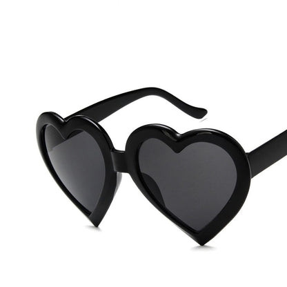 Trendy black heart-shaped sunglasses with dark lenses, FashionRay bold accessories