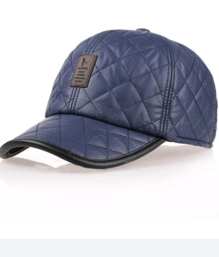 Quilted navy blue baseball cap with leather trim, trendy accessory from FashionRay