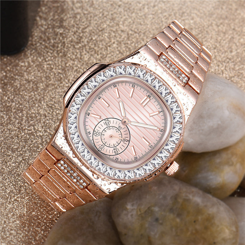 Rose gold luxury women's watch with crystal bezel on sand, FashionRay elegant accessory