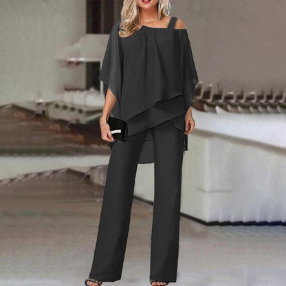 Woman in loose black off-shoulder pantsuit, FashionRay bold style, modern setting