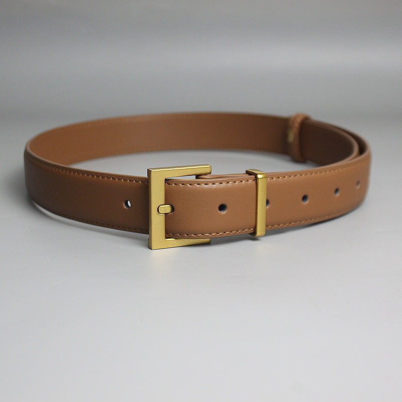 Tan leather belt with gold buckle on a white background, FashionRay trendy accessory
