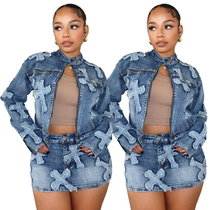 Woman in matching denim jacket and mini skirt set with cross patches, FashionRay bold style