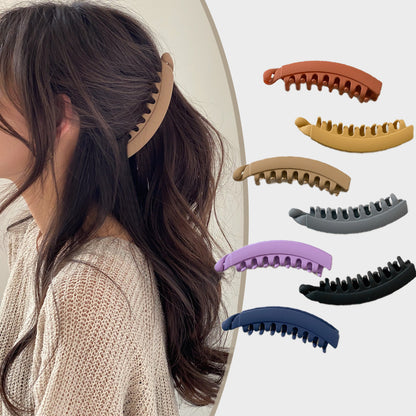 Woman wearing FashionRay large matte hair clip with assorted color claw clips shown