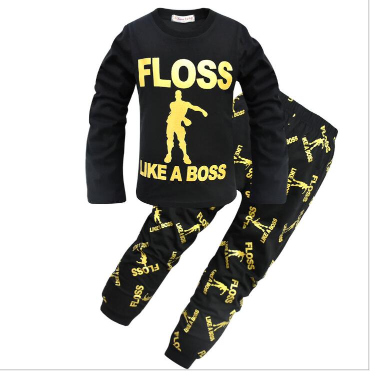 Black kids' pajama set with yellow 'FLOSS LIKE A BOSS' text and dance graphic, FashionRay