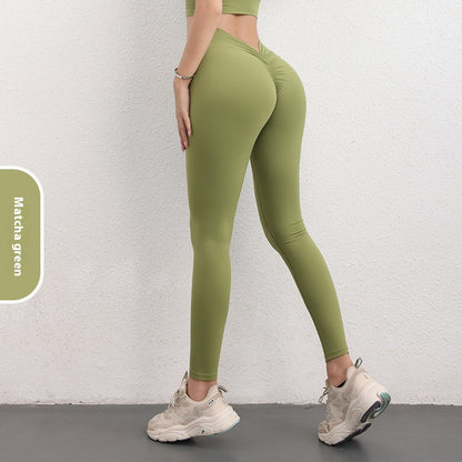 Woman wearing matcha green high-waisted leggings and crop top, FashionRay trendy athleisure