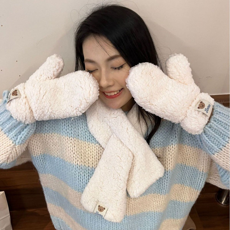 Woman in cozy blue striped sweater with fluffy white mittens and scarf, FashionRay style