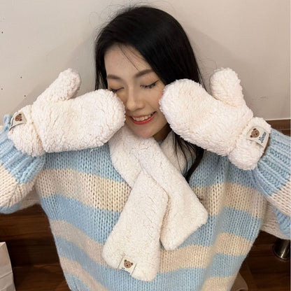 Woman in cozy blue striped sweater with fluffy white mittens and scarf, FashionRay style