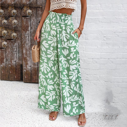 Trendy green wide-leg pants with white leaf print, paired with crochet crop top, FashionRay style