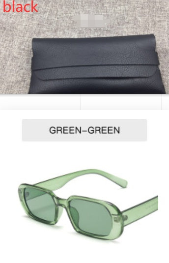 Black leather clutch bag and trendy green sunglasses, FashionRay accessories on display
