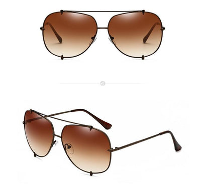 Trendy aviator sunglasses with brown gradient lenses and slim metal frame on white background.