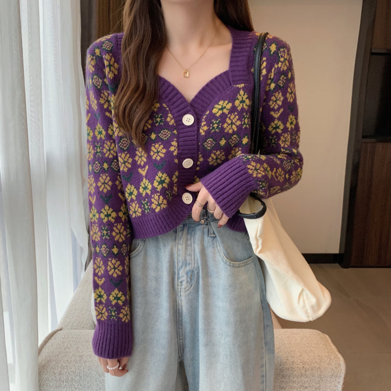 Woman in purple floral knit cardigan and light blue jeans, casual FashionRay style
