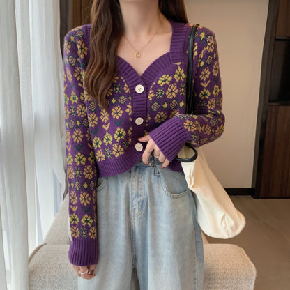 Woman in purple floral knit cardigan and light blue jeans, casual FashionRay style