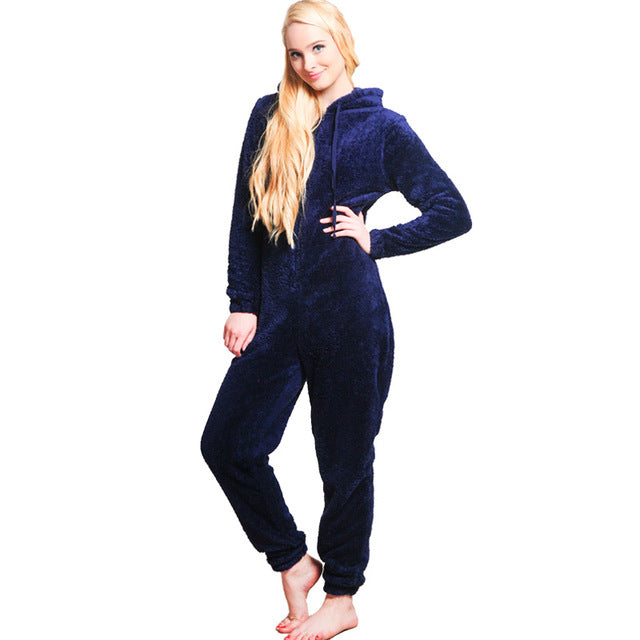 Woman wearing a navy blue fleece hooded onesie loungewear from FashionRay