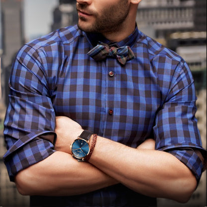 Stylish man in blue plaid shirt and bow tie wearing elegant watch, FashionRay urban fashion