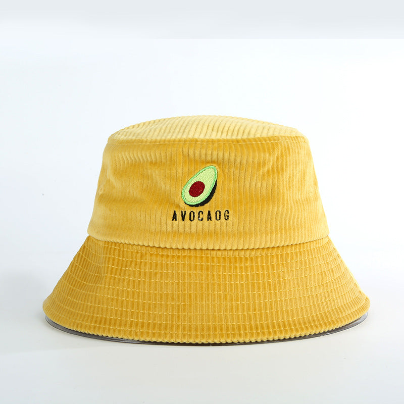 Yellow corduroy bucket hat with avocado embroidery and AVOCADG text on white background