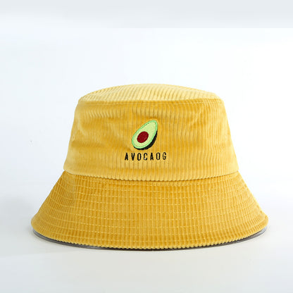Yellow corduroy bucket hat with avocado embroidery and AVOCADG text on white background