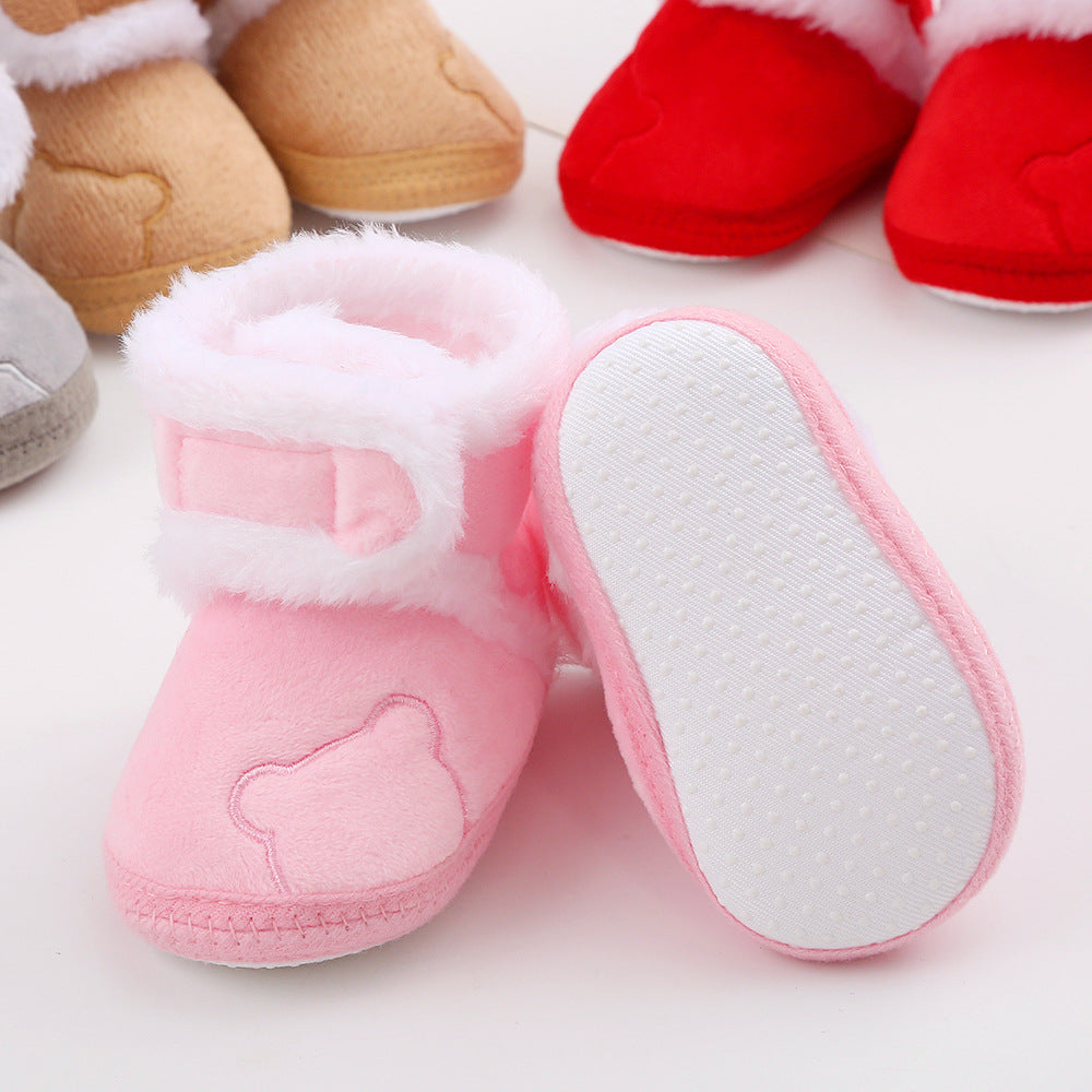 Pink plush baby booties with bear design and white fur trim from FashionRay