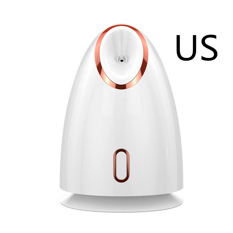 White facial steamer with rose gold trim, US plug, modern skincare device on white background