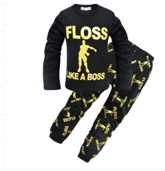 Black kids lounge set with yellow 'FLOSS LIKE A BOSS' print and dance graphic, FashionRay style
