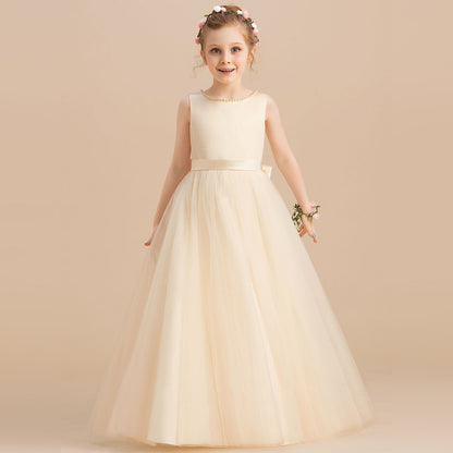 Girl in an elegant ivory tulle dress with floral headband, showcasing FashionRay style