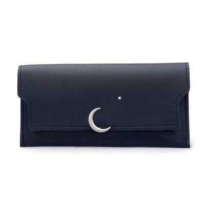 Navy blue FashionRay wallet with crescent moon and star metal accents, minimalist design