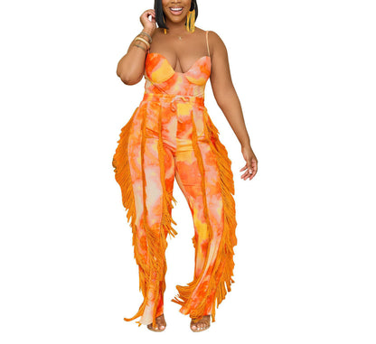 Woman in vibrant orange tie-dye fringe jumpsuit from FashionRay, trendy bold style