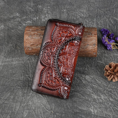 Brown embossed leather wallet with intricate floral design on textured surface, FashionRay