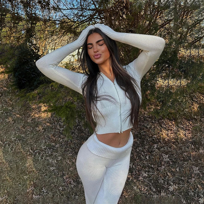 Woman modeling white ribbed knit lounge set outdoors for FashionRay