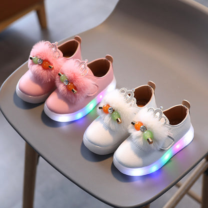 Kids' light-up fashion sneakers in pink and white with fluffy bows, beads, and crown accents